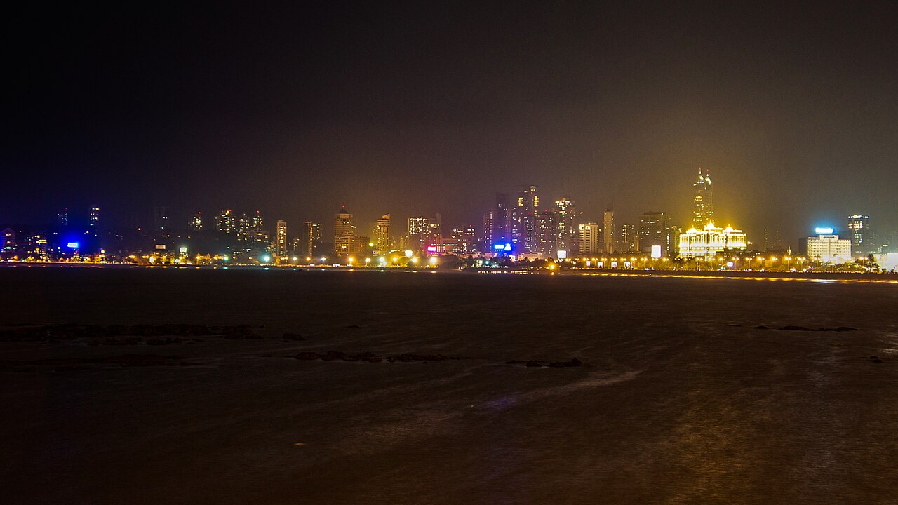 Mumbai skyline and Back Bay illuminated at night from Marine Drive